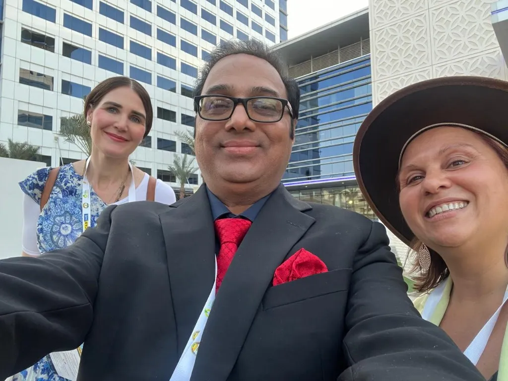 Dr. Anuj Kumar with colleagues at a professional conference venue