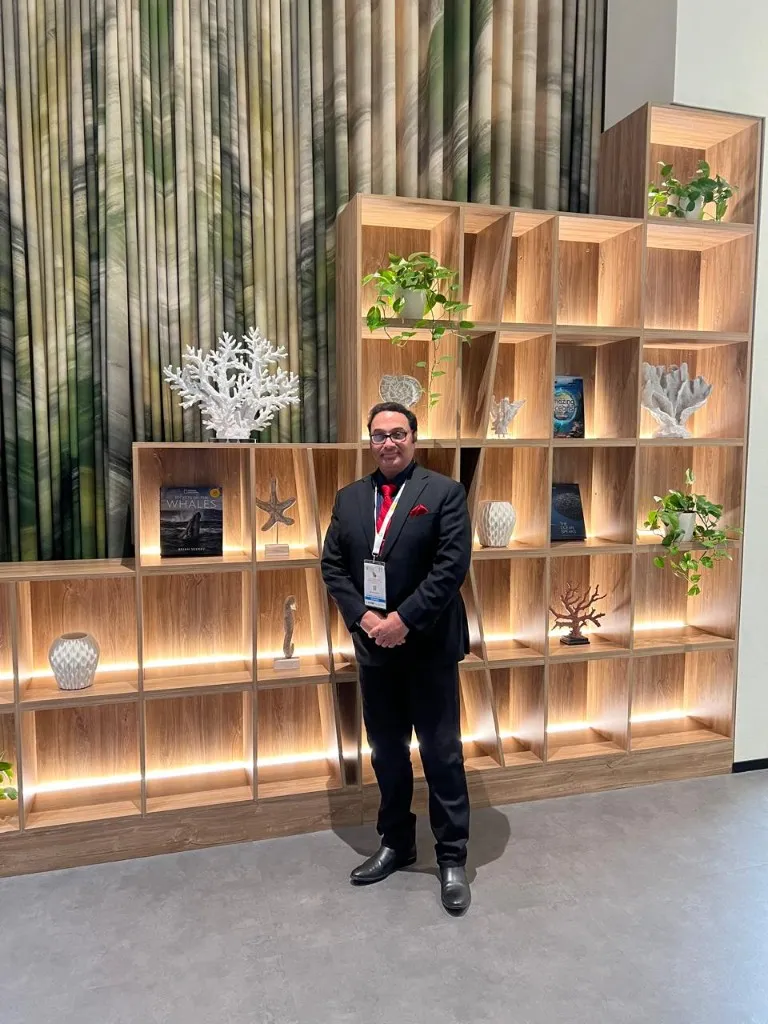 Dr. Anuj Kumar at a conference venue interior